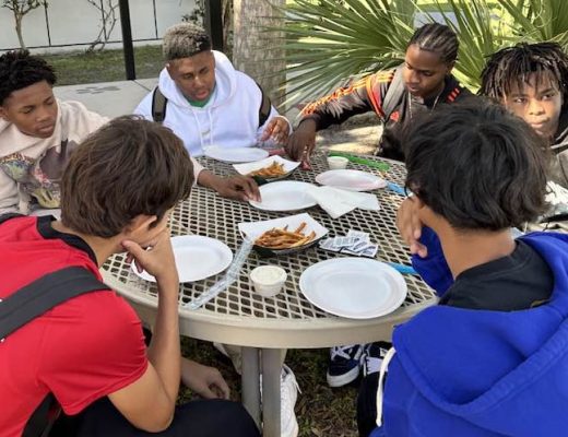Students enjoying a special lunch to reward their successes.